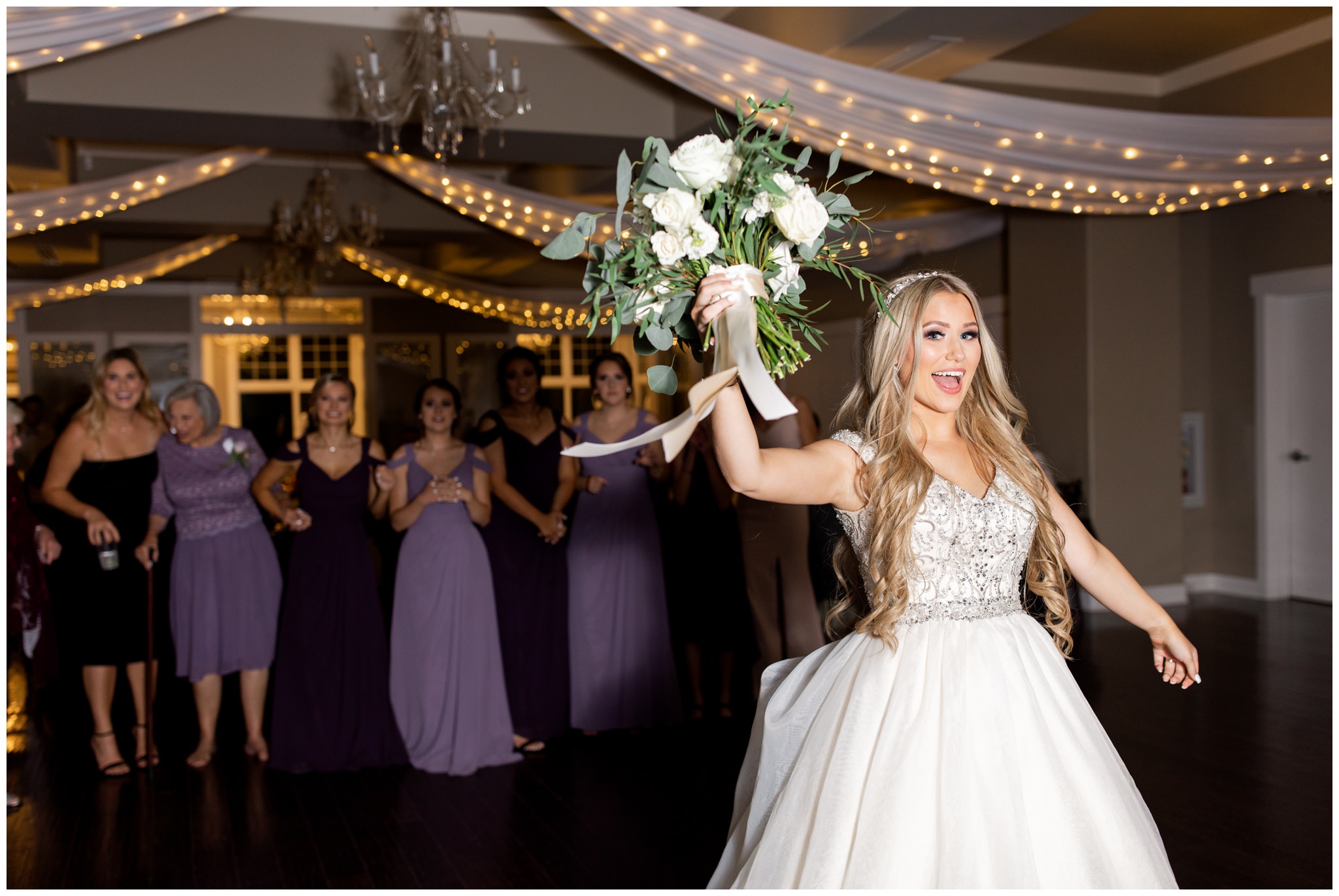 Bride tossing bouquet at Utah wedding