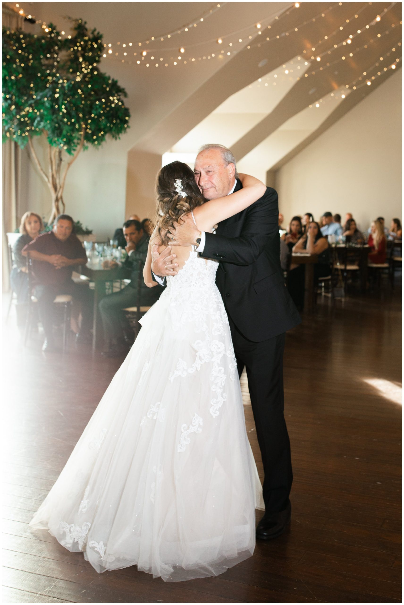 Bride dancing with her dad in the Sunset Room