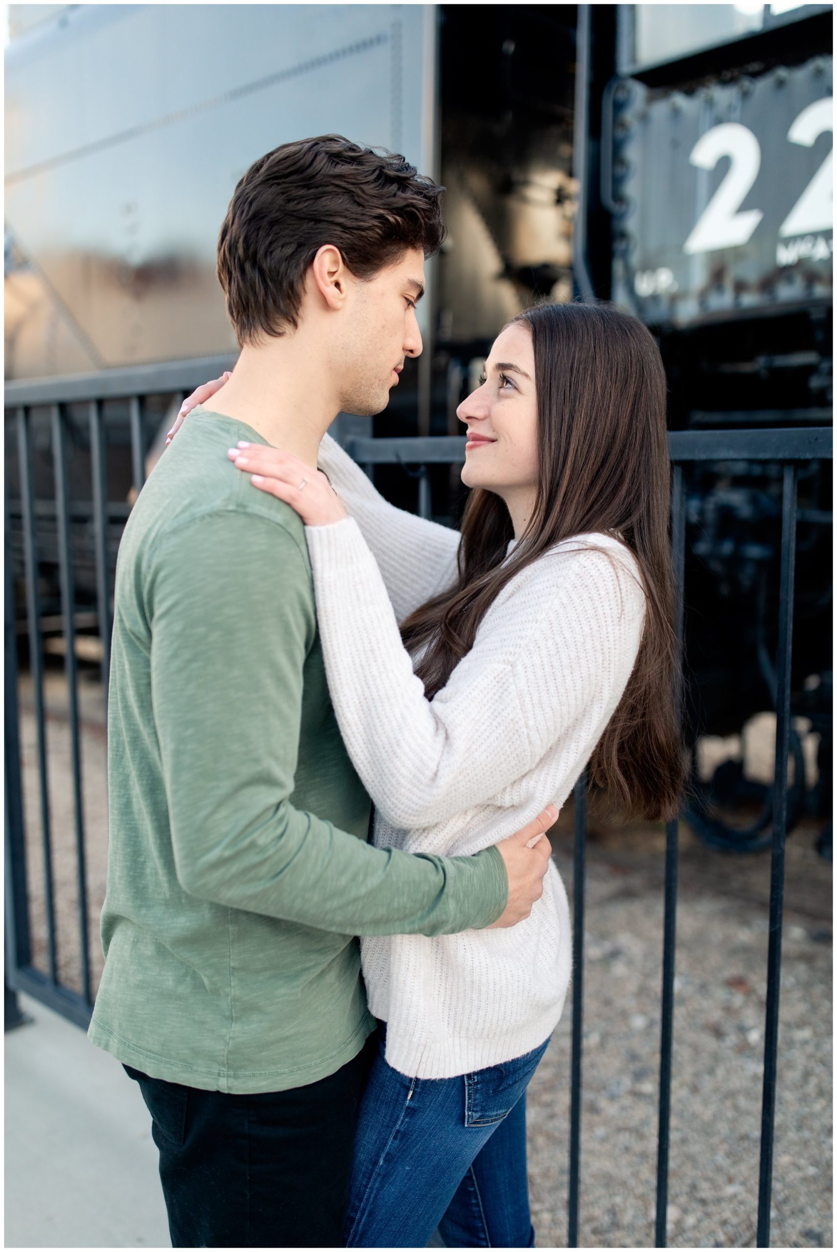 Winter Engagement photos near the black train at the Boise train depot.