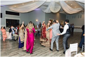 Winter Wedding at the Orion Event Center, Bride and groom dancing in cultural attire