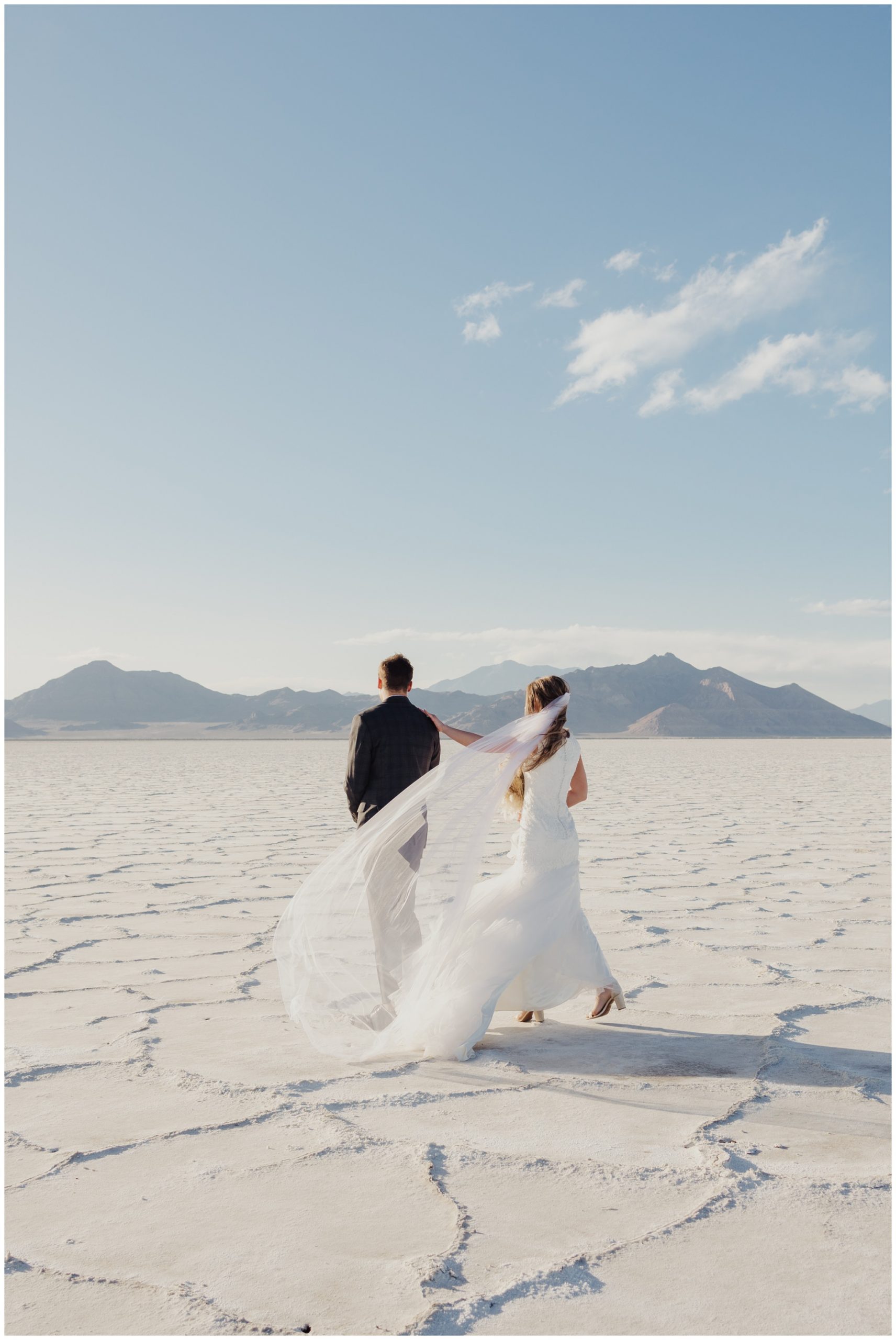 Groom getting a first look of his bride at the Salt Flats in Utah