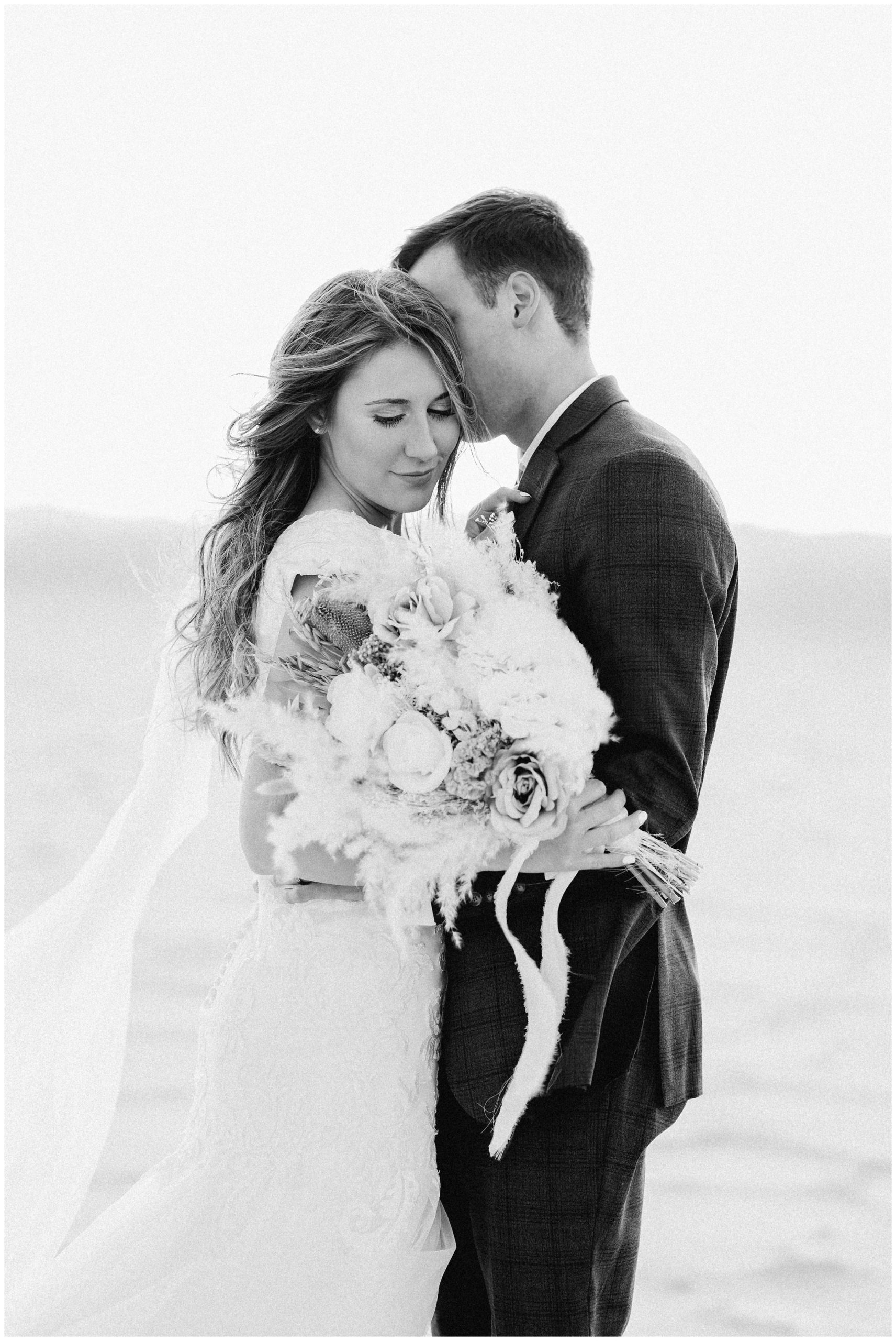 Black and White image of boho bride and groom at the Salt Flats