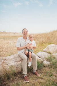 Father and Son smiling at the camera for family pictures at Lubbock Lake Landmark in Texas